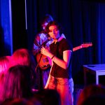 student performs on stage