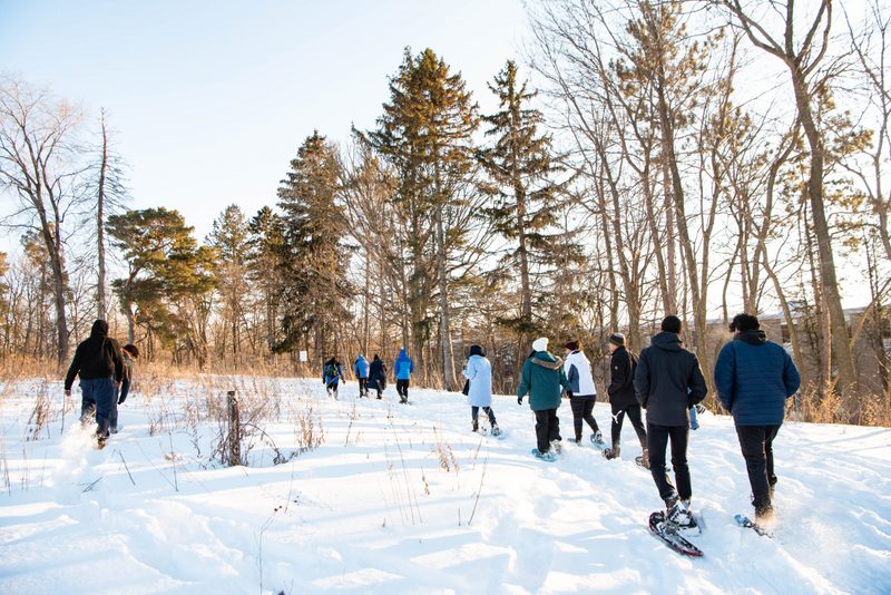 Students snowshoe in the arb