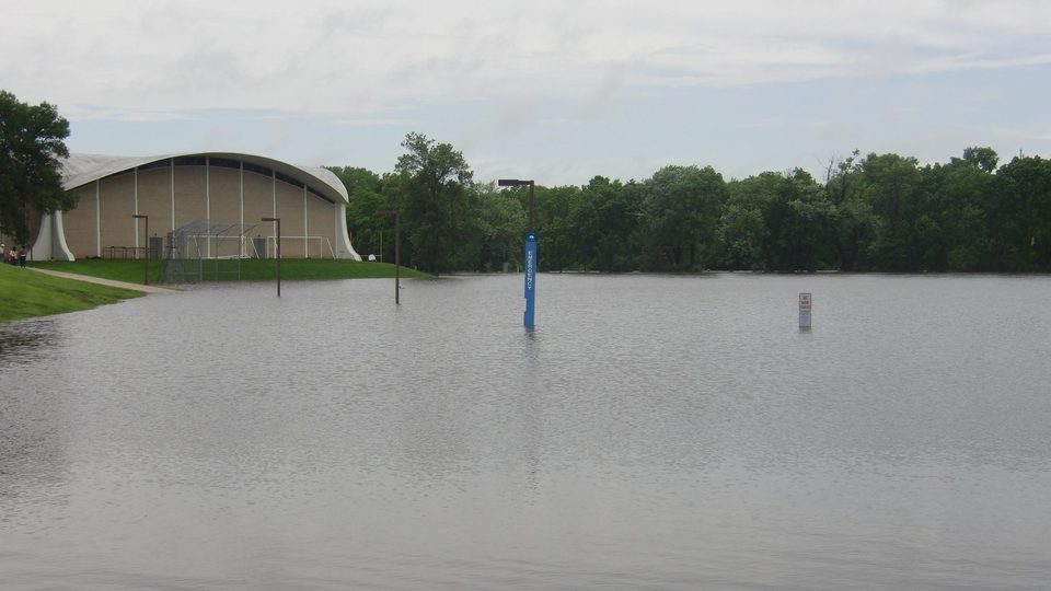 Flooding from the Cannon River surrounds West Gym on June 19, 2014.