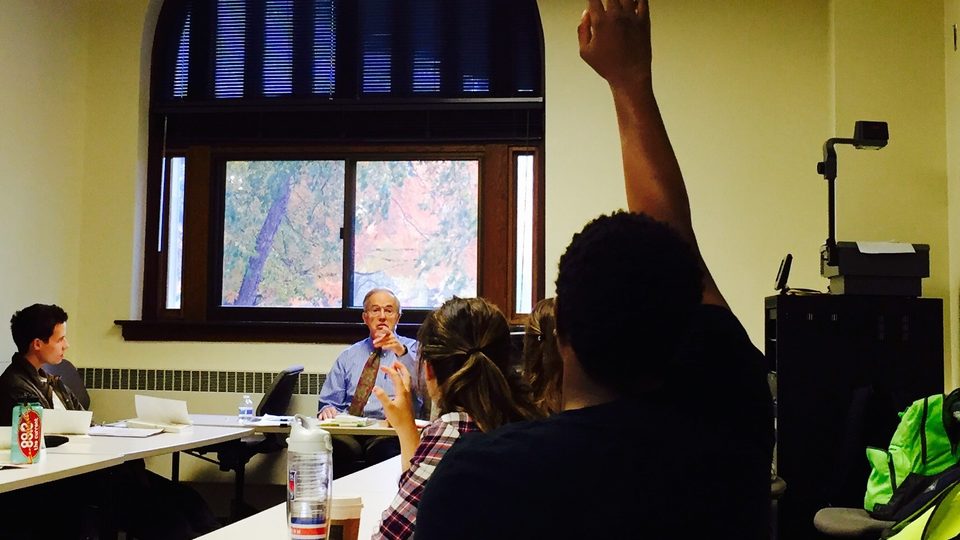 A student raises his hand in Clifford Clark's freshman history seminar.