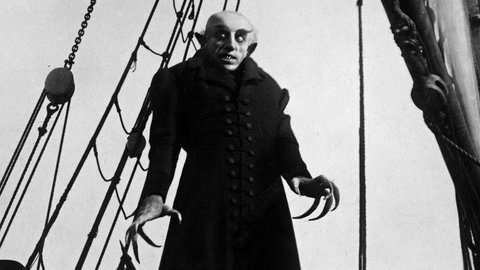 Black & white still from the classic horror film, "Nosferatu."