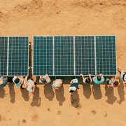 Carleton students install a solar energy system on a farm in India.