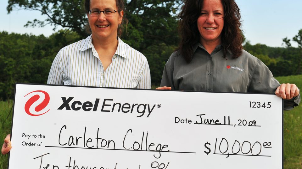 Carleton Director of Cowling Arboretum Nancy Braker (left) and Pamela Gorman, Xcel Energy Manager of Community Relations