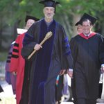 College Marshal John Schott leads President Steve Poskanzer and Convocation speaker Jimmy Kolker towards the Chapel for Opening Convocation.