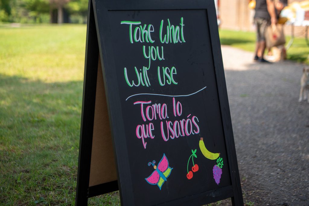 "Take what you will use." Farm to Family sign.