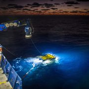 Scientists conduct deep sea research.