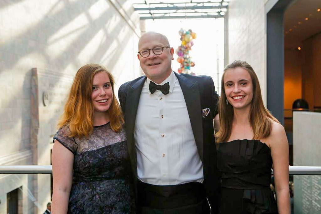 Eleanor Dollear '16, Jack Becker '86 and Sophie Buchmueller '16 in formal wear at the Joslyn Art Museum in Omaha.