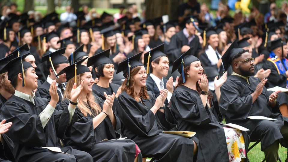 The class of 2020 claps for Anesu Masakura '20 after his speech at their makeup commencement.