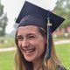 Sophia Maymudes '20 smiles at the camera in her graduation cap.