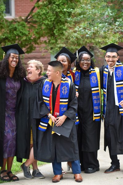 A group of 2020 Posse Scholars laugh with one of their mentors.