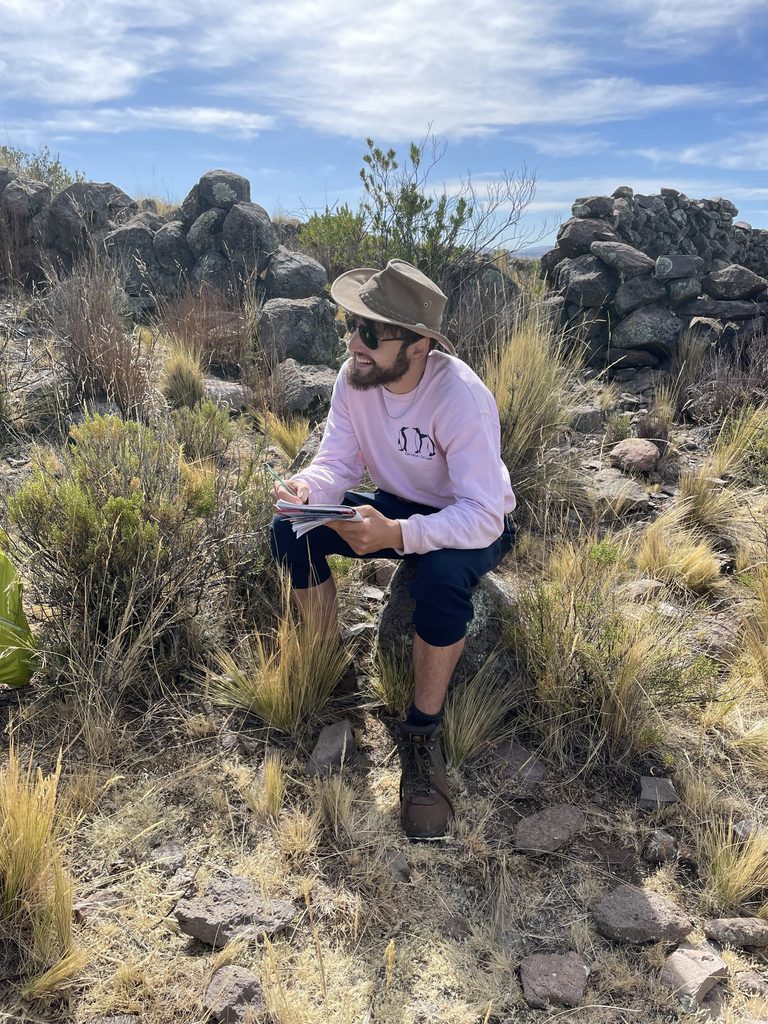 Kalju Maegi ’23 takes notes at an archaeological site.