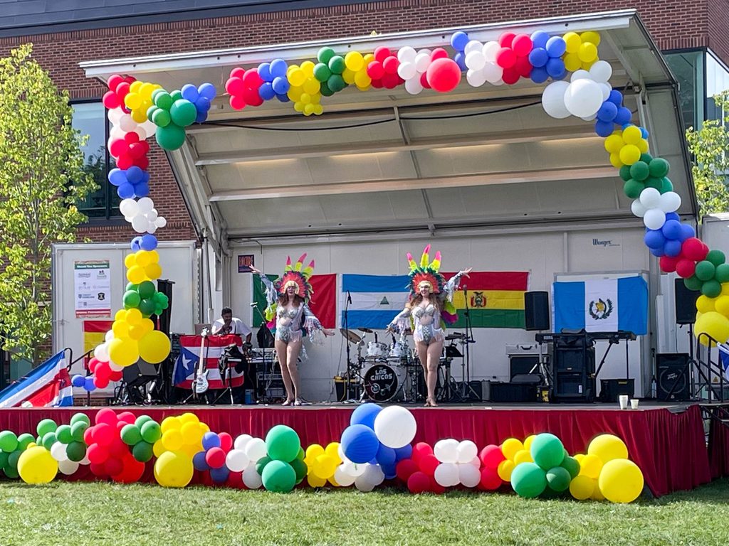 Two dancers onstage at Northfield's Hispanic Heritage Month Celebration.