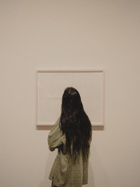 Student in front of prints by Eleanor Jenson ’01