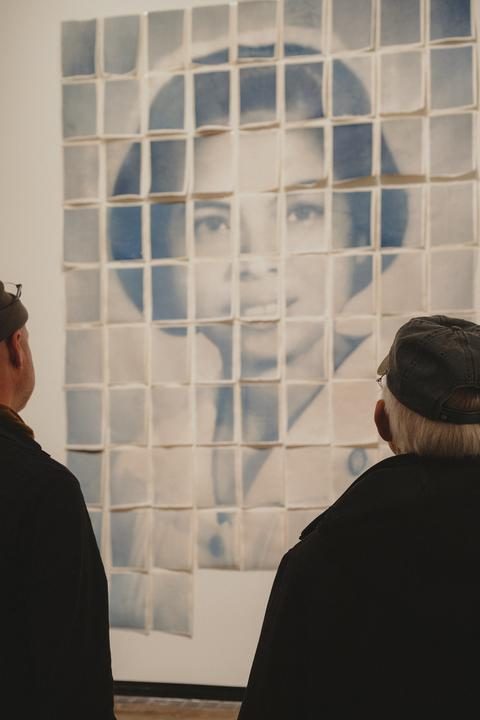 Blue and white print of woman in nurse uniform, work titled “Thank you / Salamat”