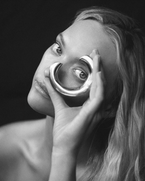 woman holding cuff to her eye