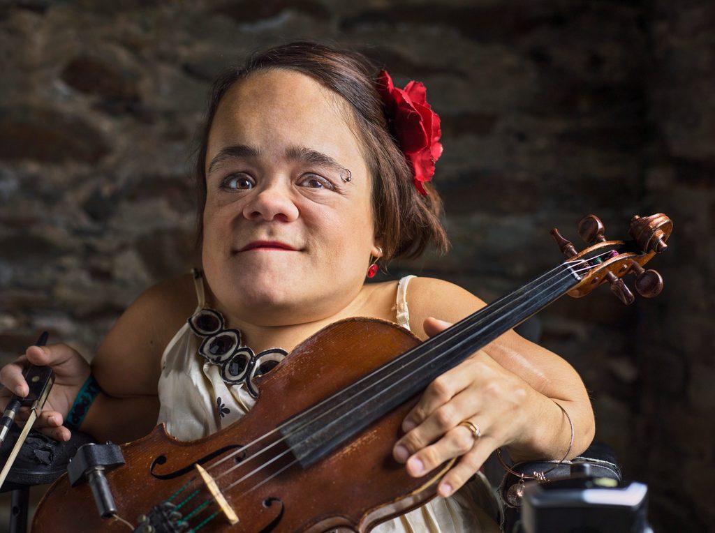 Headshot of Gaelynn Lea, holding a violin