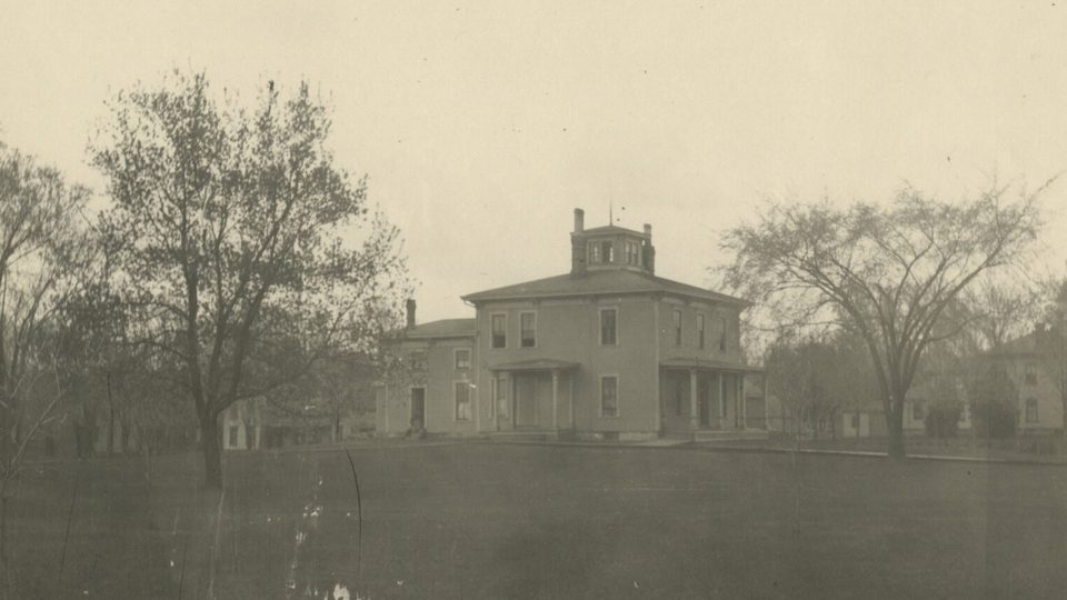 Sepia photo of Seccombe House in its original location.