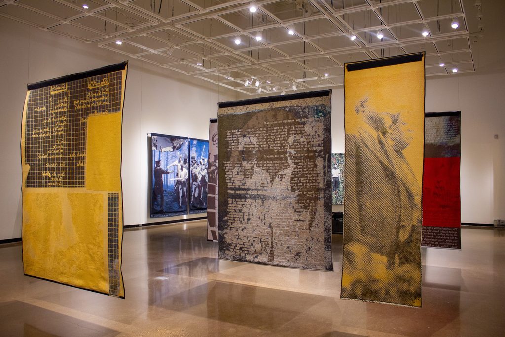Multiple tapestries hanging in the Perlman Museum.