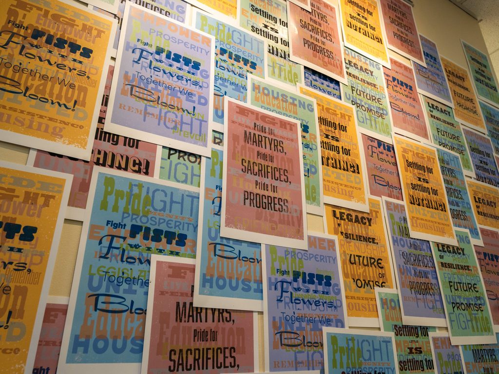 Wall of colorful posters angled upwards