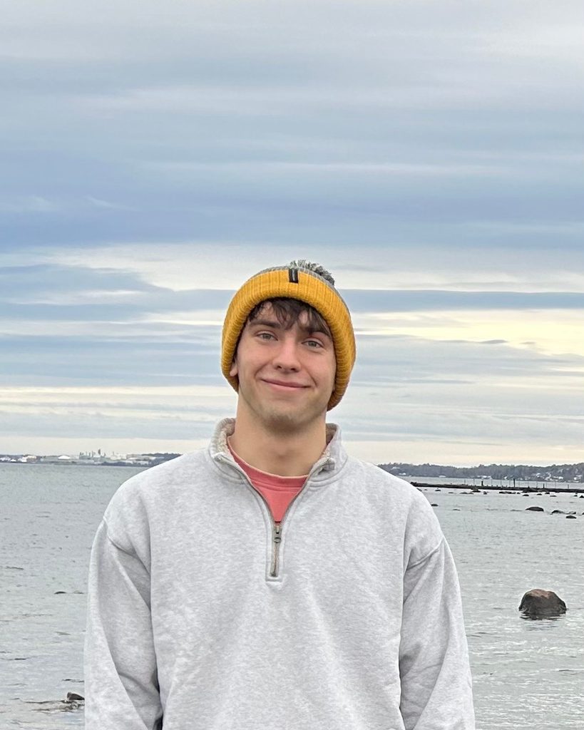 Oliver Licht standing in front of a pier.