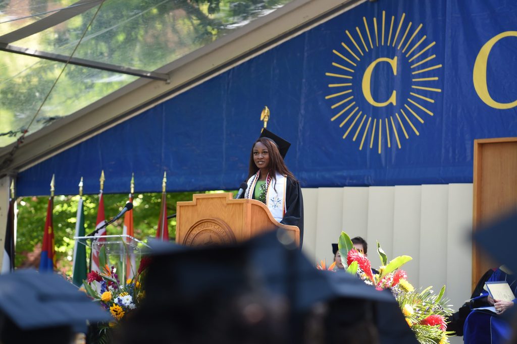 Amira Aladetan gives a speech on the Commencement stage.
