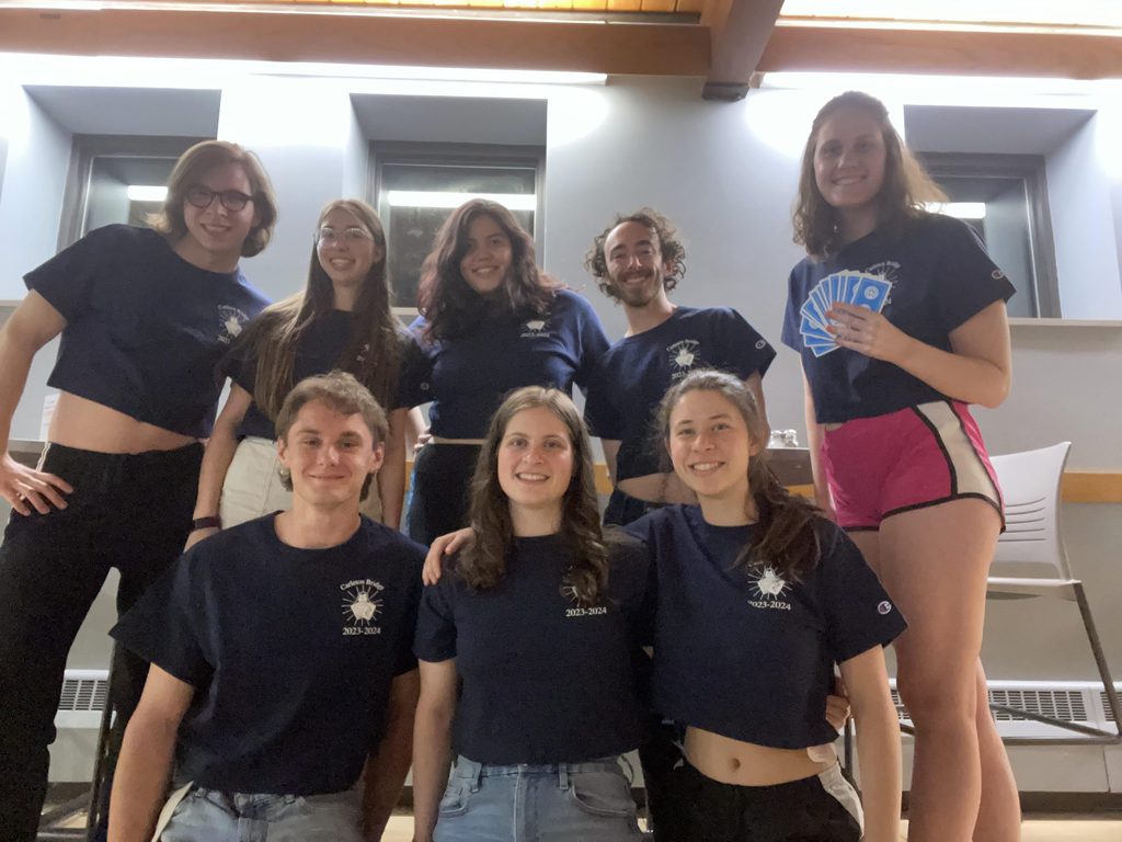 Group photo of eight students, all wearing Carleton Bridge Club shirts.