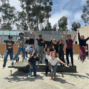 A group of people jumping outside