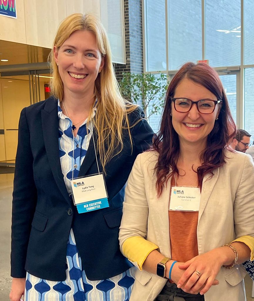 Juliane Schicker and Lydia Tang smile and pose together.
