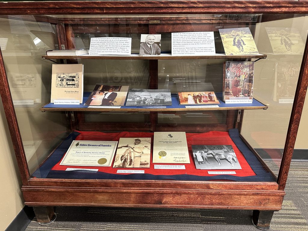 Papers in a glass case relating to Al Quie's personal life