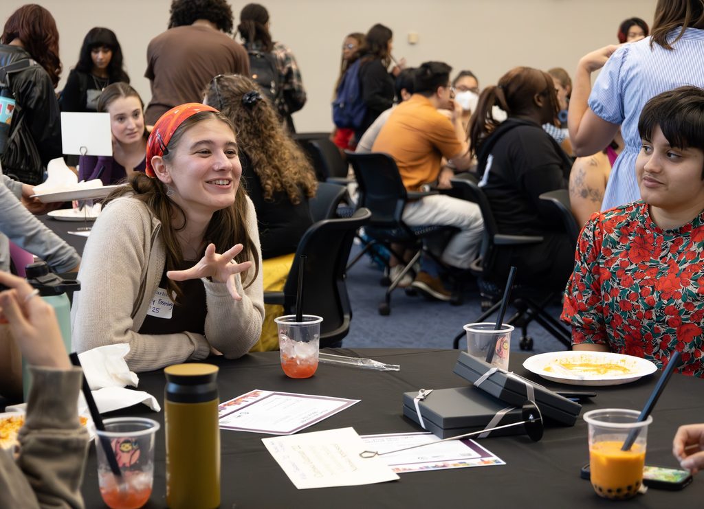 Students talk in groups in Weitz 236.