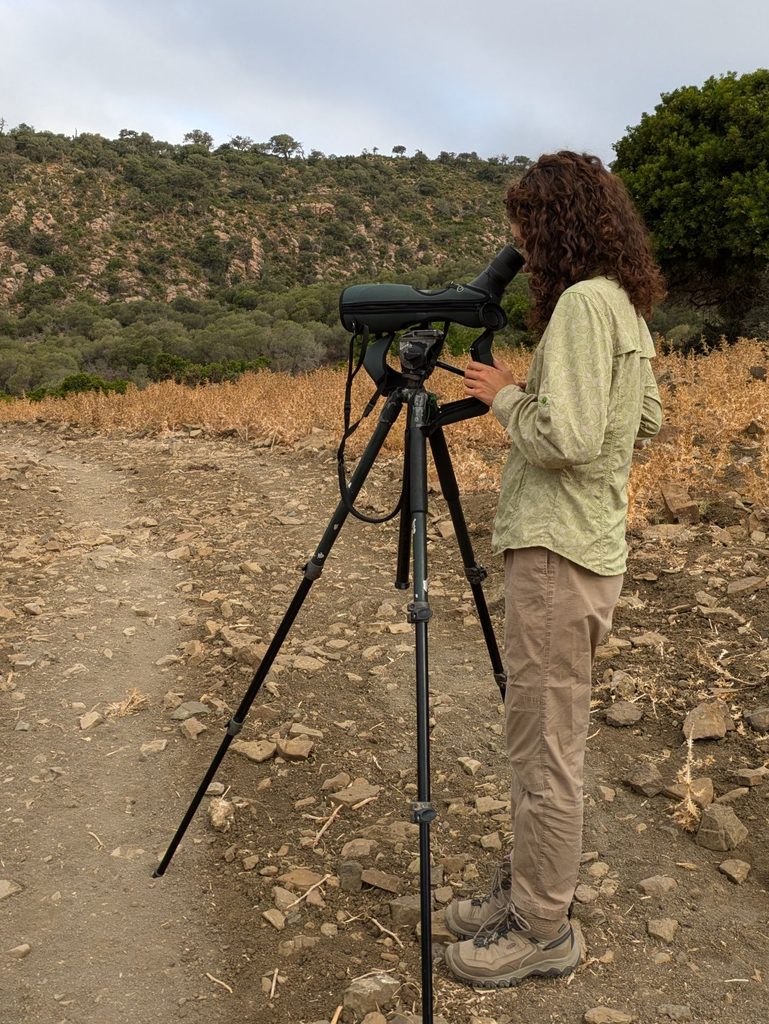 Maxima Gomez-Palmer looking through a telescope.