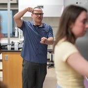 Professor Keenan Hartert guides students in solving a problem during an open hour session at Minnesota State University.