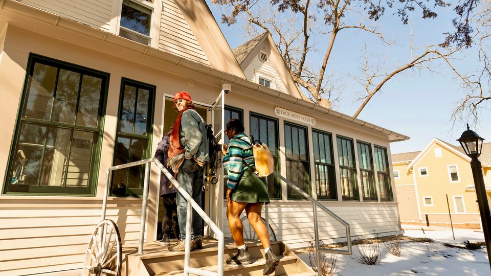 Students walk into Dacie Moses House.