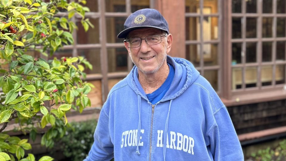 Robert Strauss in a Carleton hat and Stone Harbor sweatshirt.