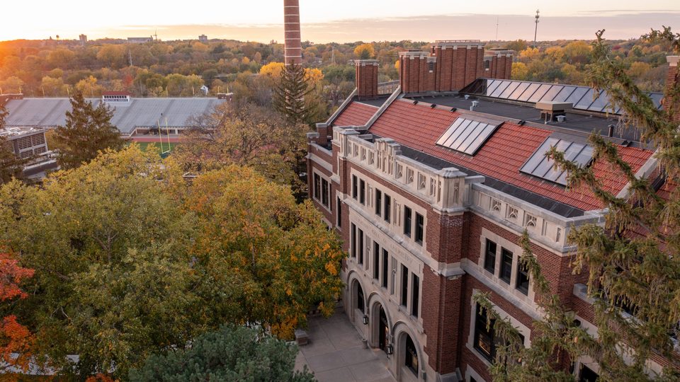 Aerial photo of Leighton Hall in the fall during sunset.