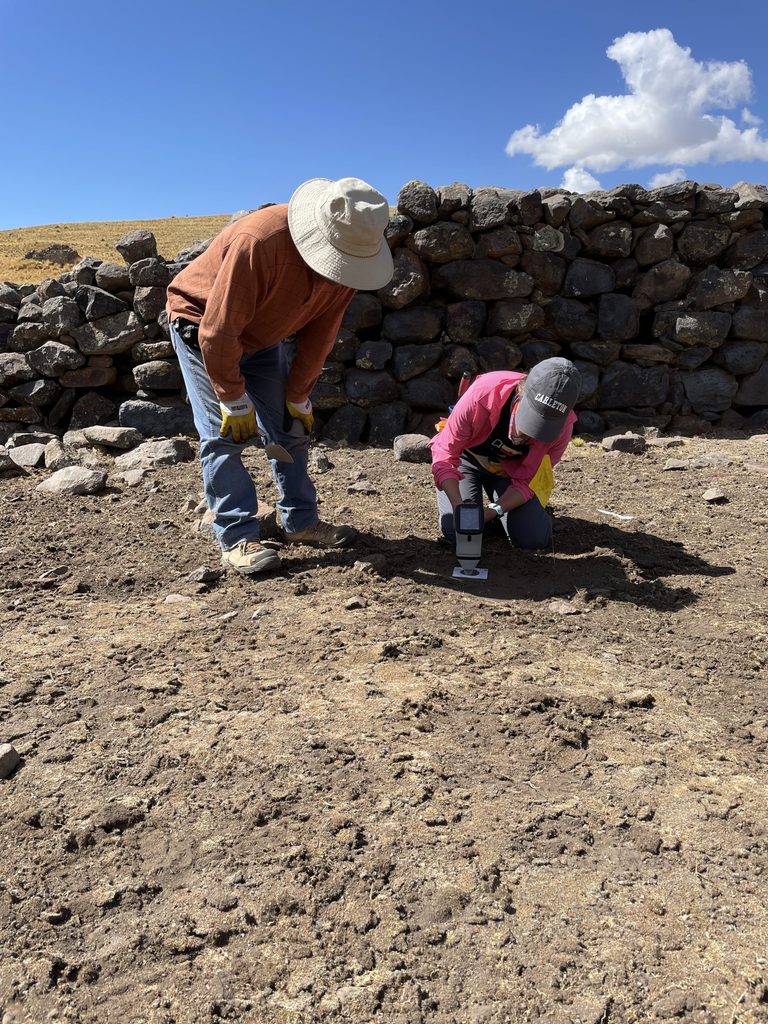 Kennedy uses a device to test soil composition