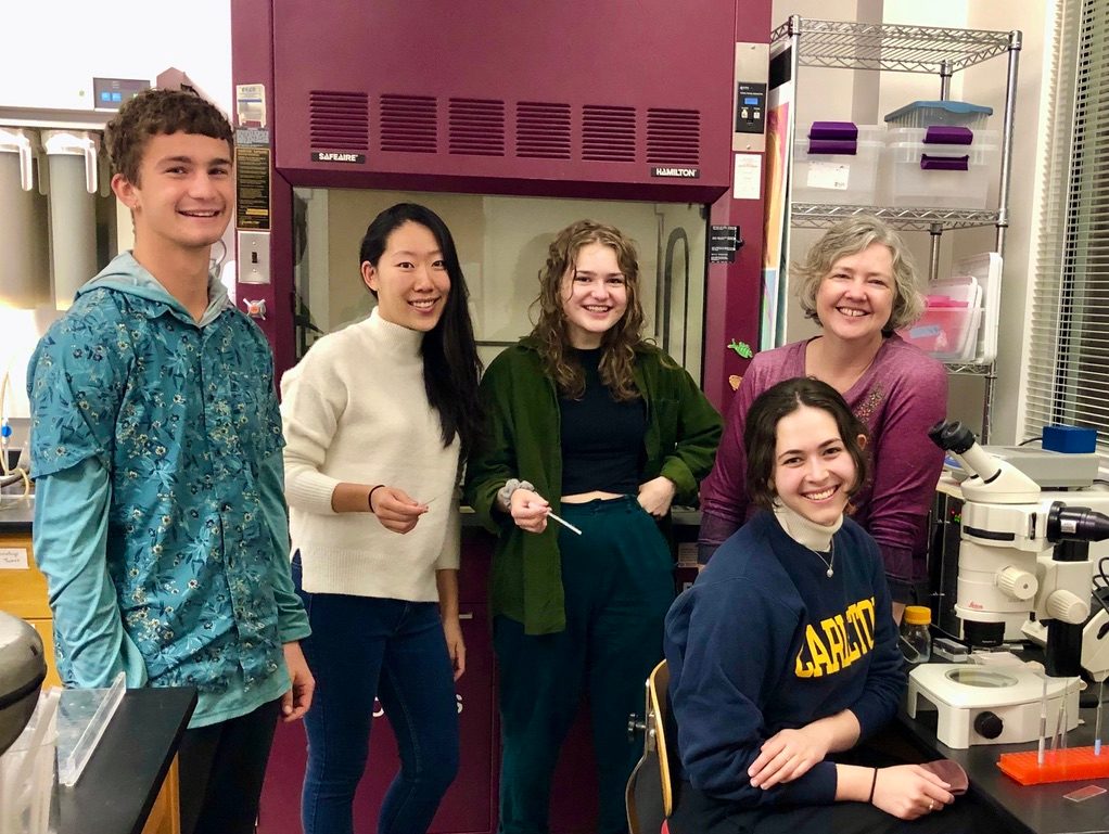 Jennifer Ross-Wolff and students smiling in lab