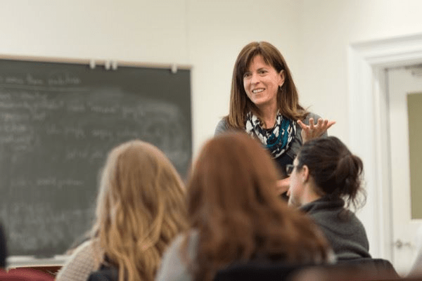 Picture of Beth Morling instructing a class, taken from the perspective of a student.