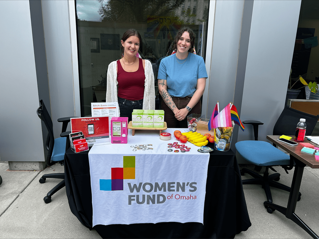 Picture of Mia Strubel Iram '25 manning a table for the Women's Fund of Omaha.