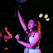 Two students performing onstage in The Cave.