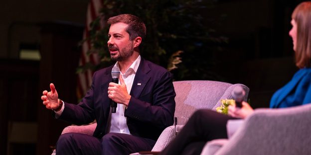 Pete Buttigieg talks onstage.