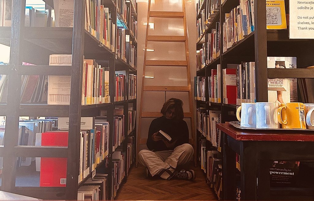 Student reading in the Gender Studies Library