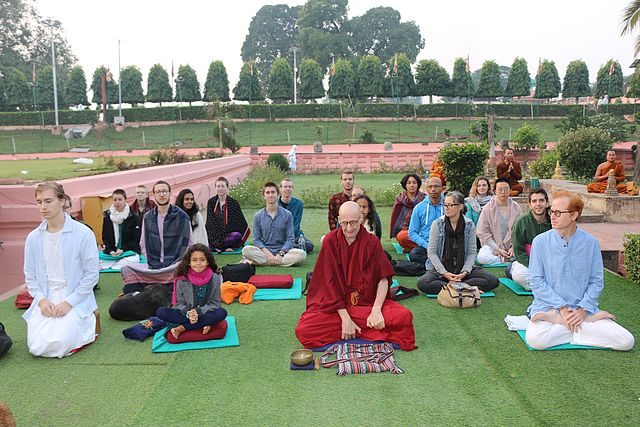 Students meditate in the garden