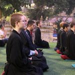 Students meditate outdoors