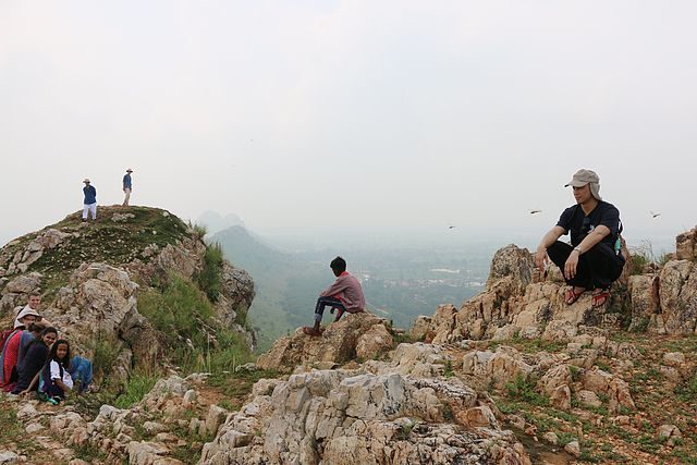Students take a break dispersed around mountaintop