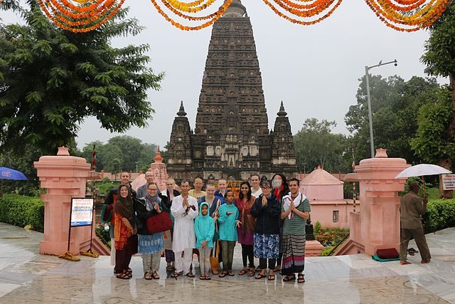 The program group poses in front of the temple