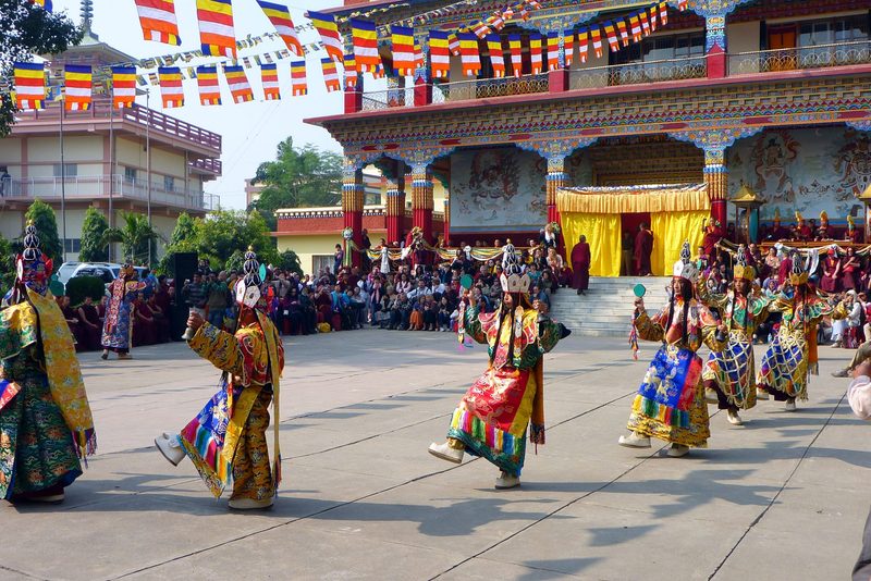 Locals in traditional dress perform a dance