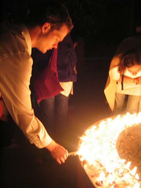 Students light candles at the temple