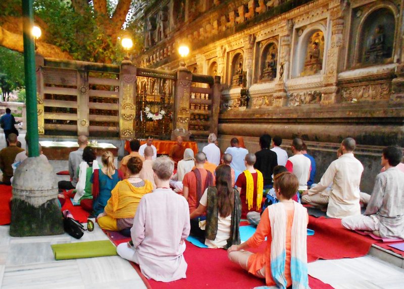 a large group practices meditation