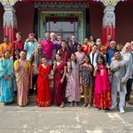 Students, instructors and staff on the steps of a Buddhist temple